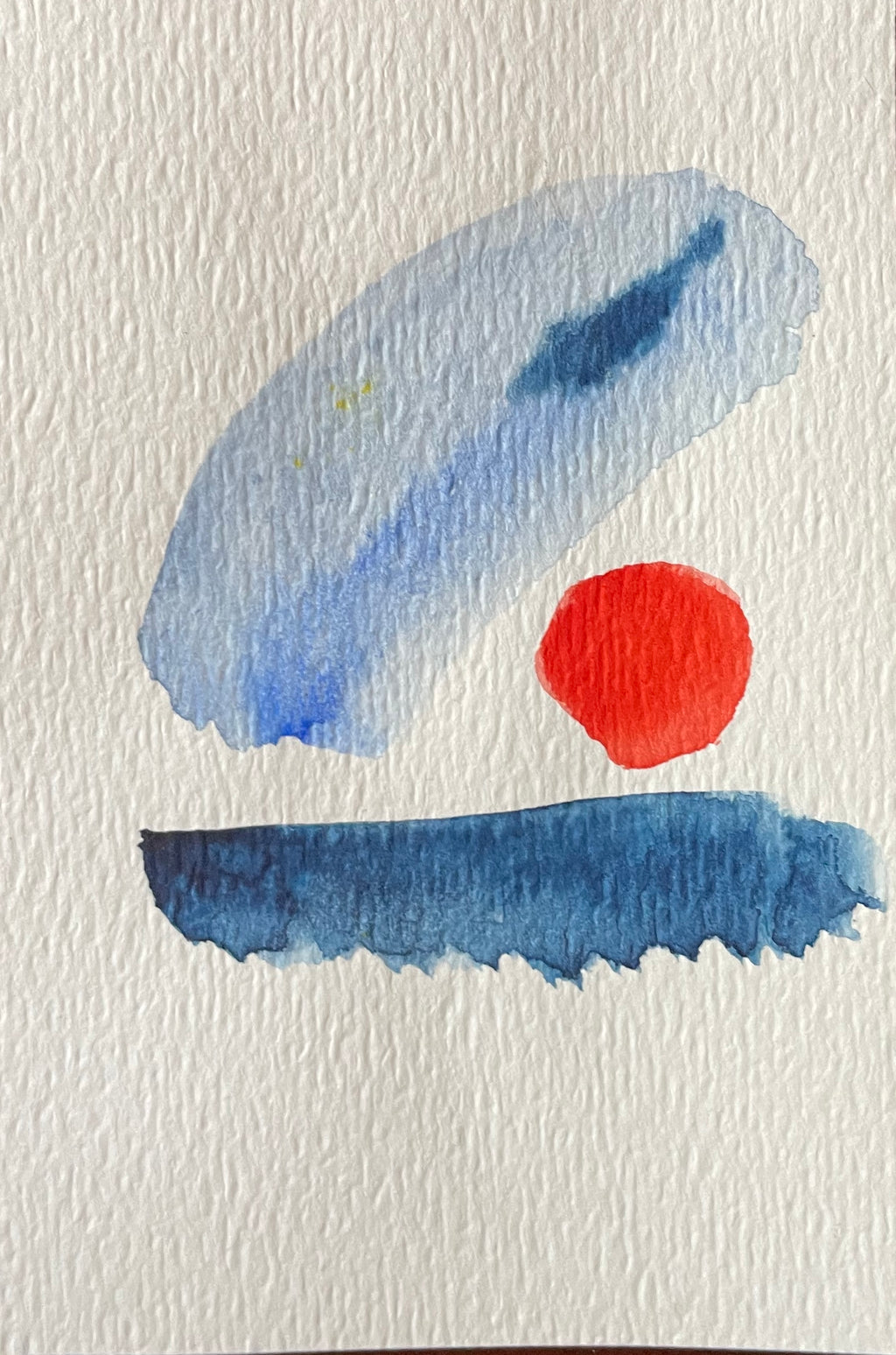 Abstract art with blue and red shapes on a textured white background